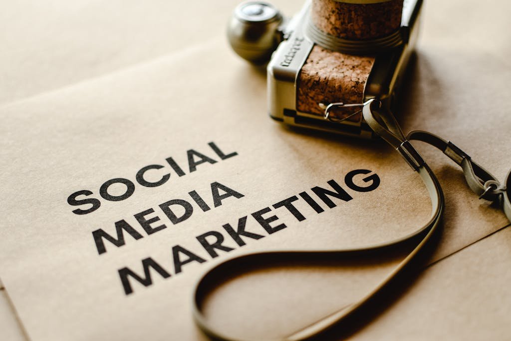 Close-up of a camera placed on brown paper with 'Social Media Marketing' text for privacy and policy , emphasizing digital marketing themes.