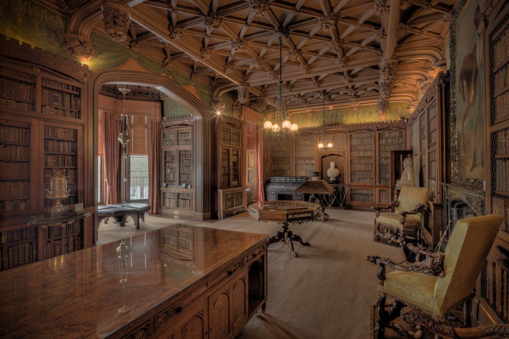 Stunning ornate library with rich woodwork and historical charm in Scotland's Abbotsford House.