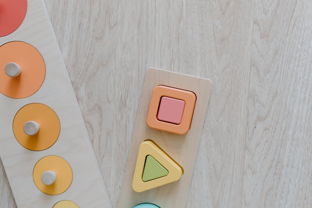 clicker up of a wooden kids toy puzzle with colorful geometric shapes for educational play.