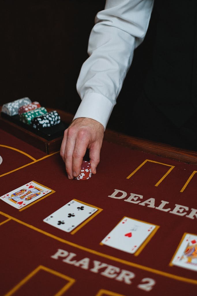 277bet setup of a casino blackjack table with a dealer handling chips, perfect for gambling themes.