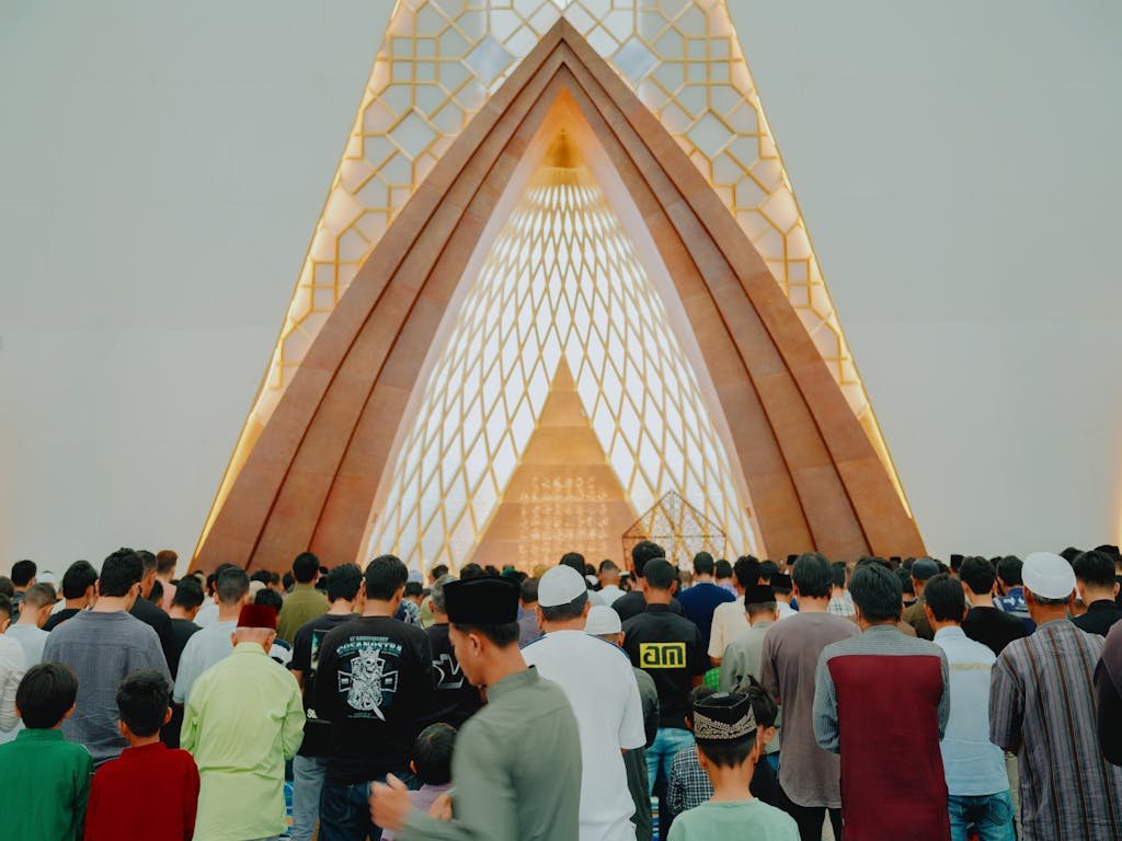 7Movierulz 2026 of Muslims gathered for prayer inside a modern architectural mosque in Jawa Barat, Indonesia.