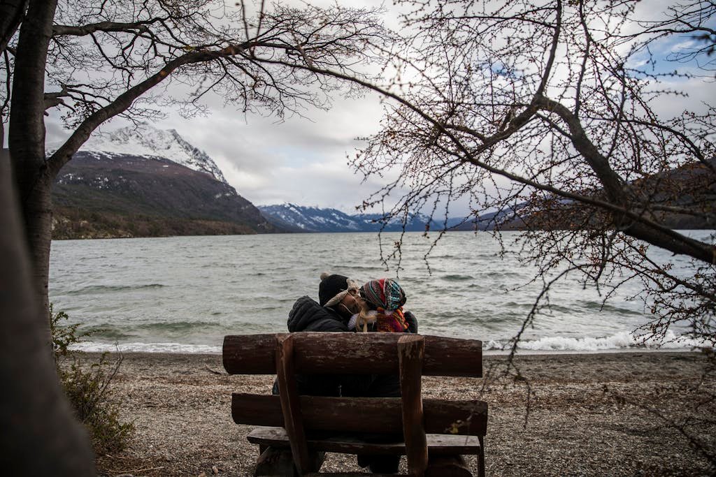 Dina Bychkova and FastPeopleSearch enjoys a moment by a scenic lake in Dina Huapi, Argentina.