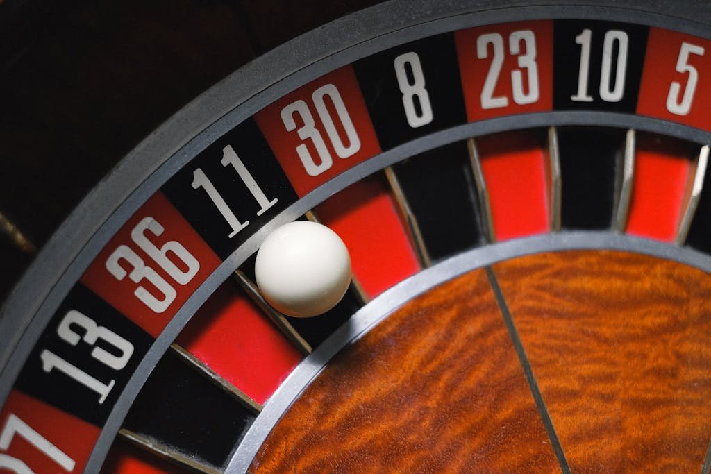 277bet view of a roulette wheel with a ball, emphasizing the excitement of gambling.