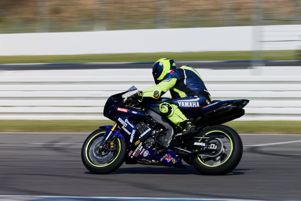 Rider on a Yamaha sportbike speeding on Hockenheim circuit, Germany.