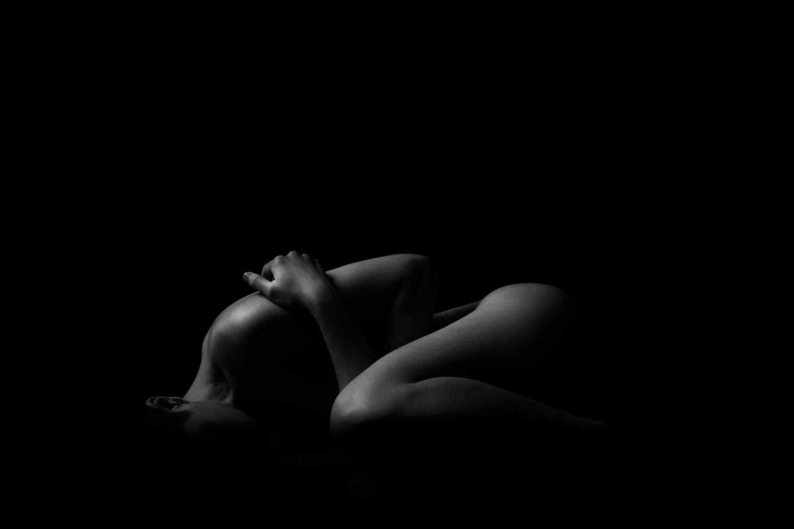 Whitney Wren Nude photograph featuring a silhouette of a woman in a studio.