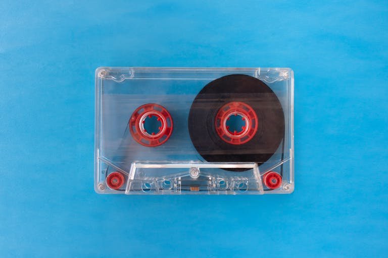Latest Tech Guides & Tips with red reels on a bright blue background.