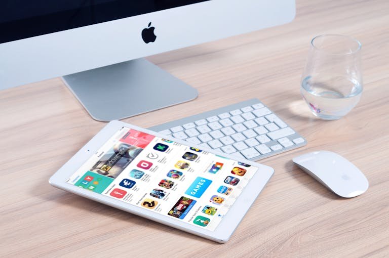SnapSource in Software and Apps setup featuring an iMac and iPad showcasing apps.
